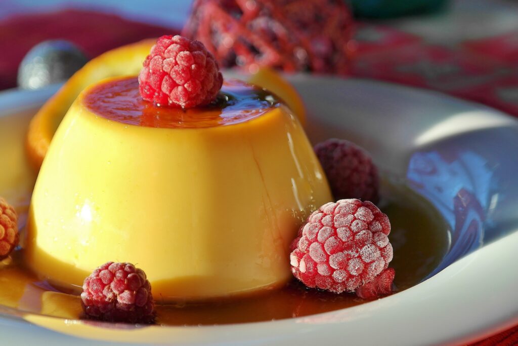 A caramel cream flan mile dessert with raspberries
