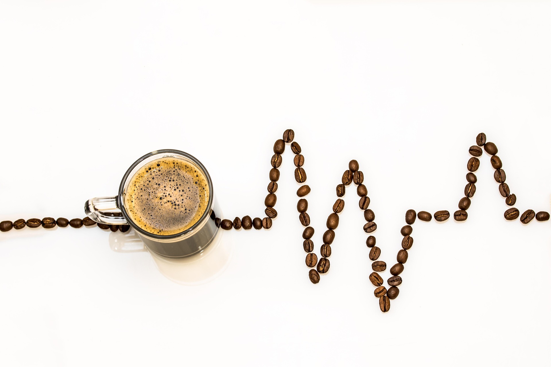 A cup of coffee with beans indicating a pulse line