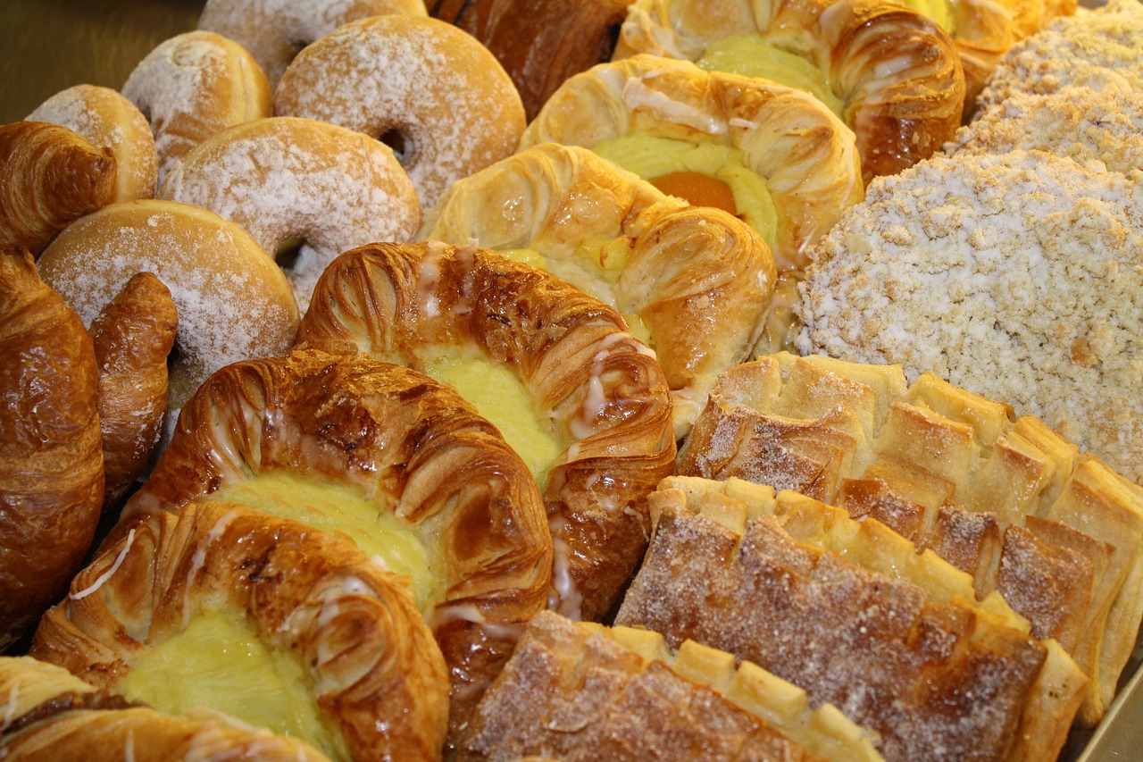 A variety of danishes with different bake-stable fillings on a tray.