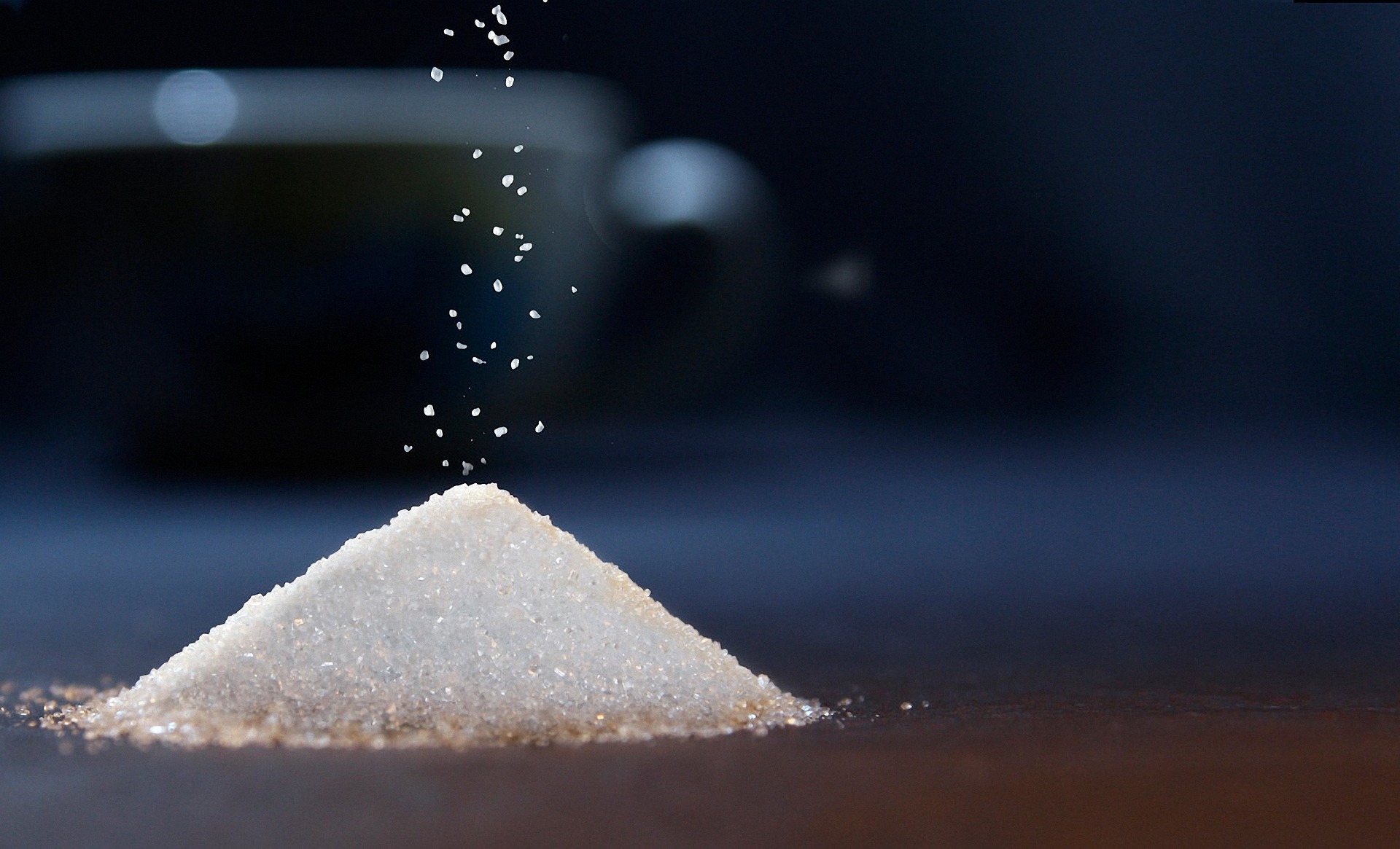 A small pile of sugar is sitting on a table